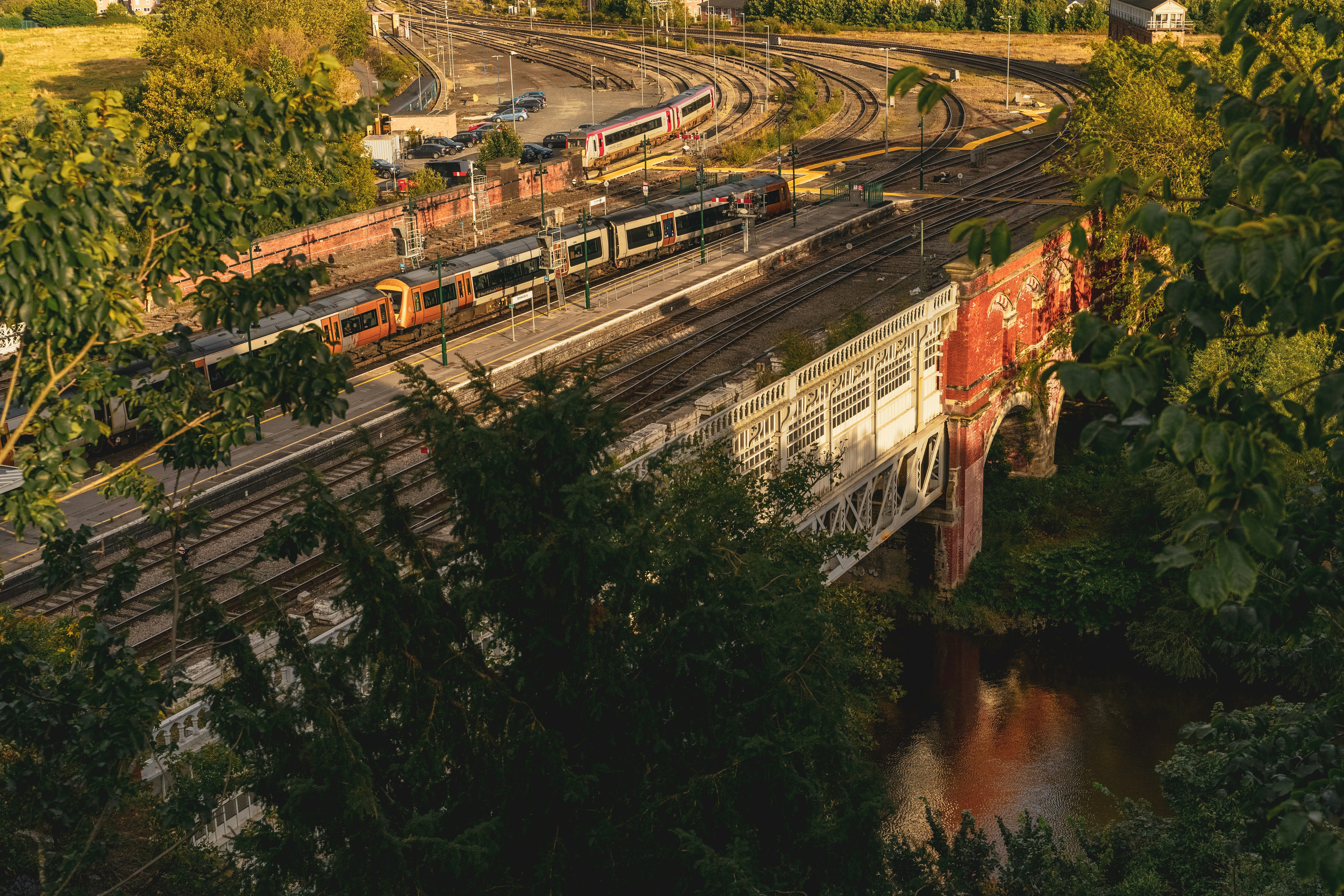 aerial view of train rail near river during daytime